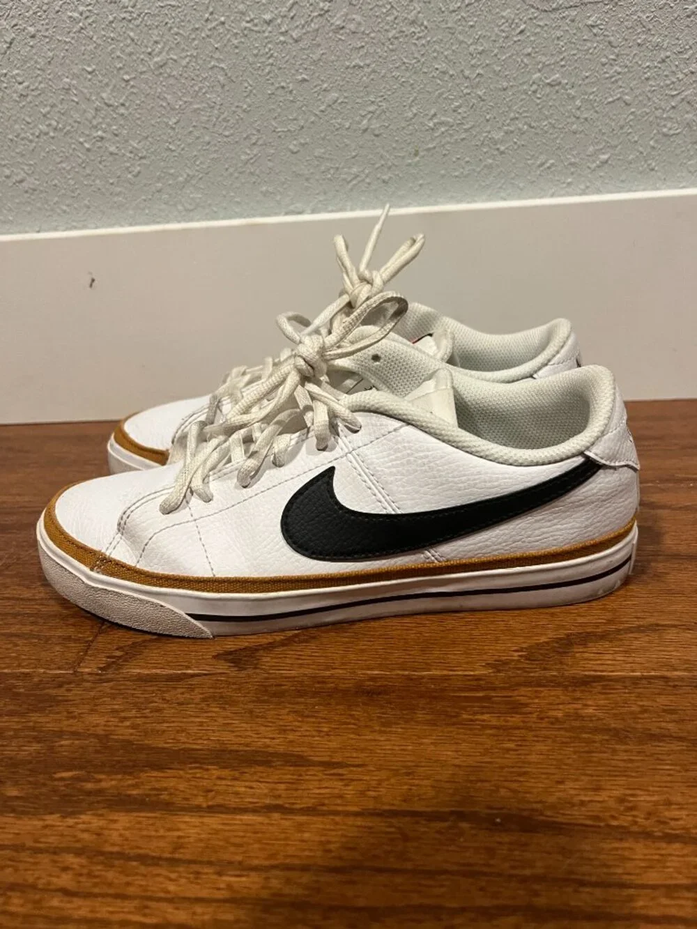 Nike Court Legacy White Sneakers with Black Swoosh and Tan Accent